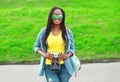 Beautiful smiling young african woman with retro vintage camera Royalty Free Stock Photo