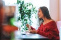 Beautiful smiling young asian woman in red clothes eating asian food in the chinese vietnamese restaurant