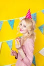 Beautiful smiling young blonde woman with a cake. Celebration and party. Royalty Free Stock Photo