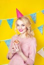 Beautiful smiling young blonde woman with a cake. Celebration and party. Royalty Free Stock Photo