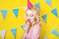 Beautiful smiling young blonde woman with a cake. Celebration and party. Royalty Free Stock Photo