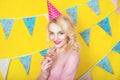 Beautiful smiling young blonde woman with a cake. Celebration and party. Royalty Free Stock Photo