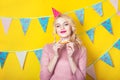 Beautiful smiling young blonde woman with a cake. Celebration and party. Royalty Free Stock Photo