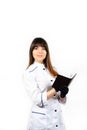 Beautiful smiling young female doctor in white medical jacket isolated on white background. Brunette woman cosmetologist holding Royalty Free Stock Photo