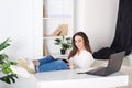 Beautiful smiling young girl working at home - freelancer. Routine work every day in the office. Rest from office work. Positive y Royalty Free Stock Photo