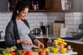 Young pregnant woman preparing healthy food with fruit and vegetables Royalty Free Stock Photo