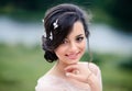 Beautiful smiling young woman enjoys a spring day. Creative hairstyle with butterflies in your hair Royalty Free Stock Photo