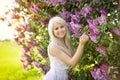 Beautiful smiling young woman with lilac flowers Royalty Free Stock Photo