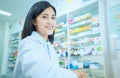 Beautiful smiling young woman pharmacist doing his work in pharmacy Royalty Free Stock Photo