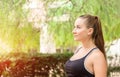 Beautiful smiling young woman with ponytail, breathing fresh air Royalty Free Stock Photo