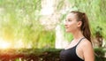 Beautiful smiling young woman with ponytail, breathing fresh air Royalty Free Stock Photo