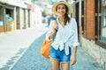 Beautiful smilling tourist woman walking old town street, summer adventure vacation in Europe. Royalty Free Stock Photo