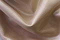 Beautiful smooth elegant light brown satin silk fabric texture. Royalty Free Stock Photo