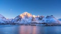 Beautiful snow covered mountains and blue sky reflected in water Royalty Free Stock Photo