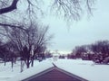 Beautiful Snow Covered Town with Rooftops and Trees