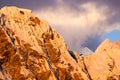 Beautiful snow and ice mountain peaks at sunset under an expressive sky