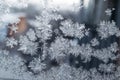 Beautiful snow patterns, water ornaments on transparent glass.Christmas snowflakes. Royalty Free Stock Photo