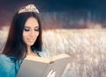 Beautiful Snow Queen Reading a Book Royalty Free Stock Photo