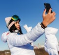 Beautiful snowboarder athlete photographed herself