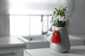 Beautiful snowdrops with traditional martisor on table indoors, space for text. Symbol of first spring day