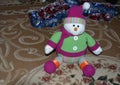 Beautiful snowman near colored New Year \'s Eve girleans.