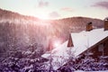 Beautiful forest and cottage on winter day Royalty Free Stock Photo