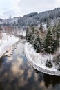 Beautiful snowy winter forest landscape, Tepla River under Brezova dam Royalty Free Stock Photo