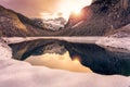 Beautiful snowy winter landscape with Dachstein mountain and Gosausee in Austria near Hallstatt with sun