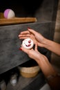 Beautiful soap with petals in the hands of woman in the bathroom. Royalty Free Stock Photo