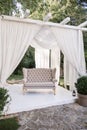Beautiful sofa in a tent in the garden