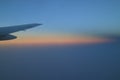 Beautiful soft color of sunrise sky with airplane wing, Background Royalty Free Stock Photo