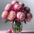 Soft pink peonies in a glass vase