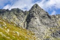 The beautiful solid wall of the Wolowa Turnia Volia veza peak with the climbing classics of the Slovak Tatras Royalty Free Stock Photo