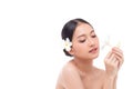 Beautiful spa Asian model girl holding plumeria flowers with make up and beauty healthy skin color lips red and hair portrait. Royalty Free Stock Photo