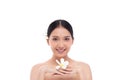 Beautiful spa Asian model girl holding plumeria flowers with make up and beauty healthy skin color lips red and hair portrait. Royalty Free Stock Photo