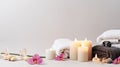 Beautiful spa banner with composition of towels, white burning candles, purple orchid flowers, grey stones on light Royalty Free Stock Photo