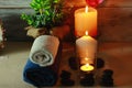 Beautiful spa composition with candles, flowers, jars of mineral salts, oils and other decoration elements