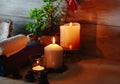 Beautiful spa composition with candles, flowers, jars of mineral salts, oils and other decoration elements