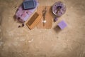 Purple sea salt, a wooden comb towel on a concrete brown background. Royalty Free Stock Photo