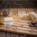 Beautiful spa composition with natural soaps with scented candles and bathroom accessories in a romantic setting for a cleansing Royalty Free Stock Photo