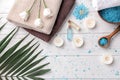Beautiful spa composition with sea salt, flowers and candles on wooden background, top view Royalty Free Stock Photo