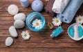 Beautiful spa composition with sea salt, towels and candles on wooden background, top view Royalty Free Stock Photo