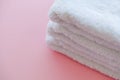 Beautiful Spa Composition White Towels on Pink Table. Royalty Free Stock Photo