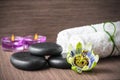 Beautiful spa concept of passiflora flower, black zen stones, pu Royalty Free Stock Photo
