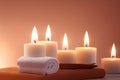 Beautiful spa setting with candles and hot stones on wooden background. Beauty wellness center treatment and relax concept. Royalty Free Stock Photo