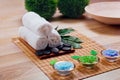 Beautiful spa and wellness setting composition on massage table in relax center on blackboard with copy space.Towel, Salt, Plumeri Royalty Free Stock Photo