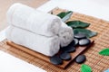 Beautiful spa and wellness setting composition on massage table in relax center on blackboard with copy space.Towel, Salt, Royalty Free Stock Photo