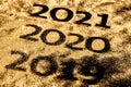 Beautiful sparkling Golden Numbers of 2019 to 2020 on black background for design, happy new year concept Royalty Free Stock Photo