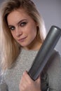 Beautiful spectacular blonde with a baseball bat in her hands.