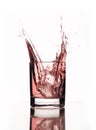 A beautiful splash of pink water in a glass Royalty Free Stock Photo